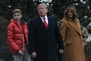 9291898-6659363-Though_Melania_was_all_smiles_her_son_avoided_reacting_to_the_ca-a-36_1549060036871.jpg