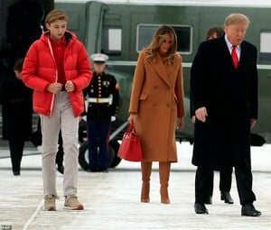 9292632-6659363-Big_guy_The_couple_traveled_with_their_12_year_old_son_Barron_wh-a-31_1549060036764.jpg