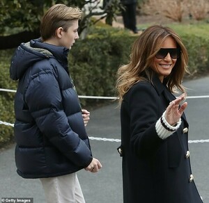 10748236-6787163-Good_mood_Though_Barron_avoids_looking_at_photographers_Melania_-m-37_1552063572819.jpg