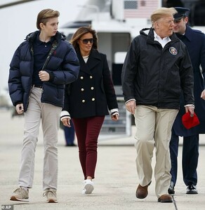 10748248-6787163-Big_kid_Barron_12_towered_over_his_mother_in_a_368_blue_Polo_Ral-m-35_1552063539218.jpg