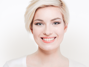 stock-photo-smiling-cute-woman-looking-at-camera-isolated-on-a-white-background-394082983.jpg