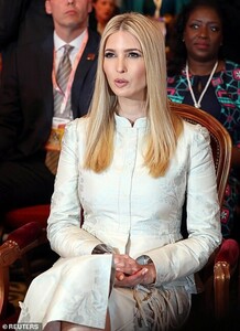 12399854-6933847-Outfit_Ivanka_opted_to_wear_a_skirt_suit_featuring_a_peplum_jack-a-130_1555537005034.jpg