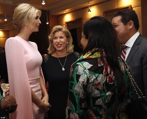 12407206-6933847-Glamorous_Ivanka_s_long_blonde_hair_was_pulled_up_into_a_teased_-m-13_1555539073452.thumb.jpg.c01bb5ac2988a71fed50f87720bdf858.jpg