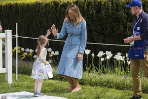 12579976-6947099-The_first_lady_gave_high_fives_and_handed_out_Be_Best_stickers_t-a-76_1555955035485.jpg