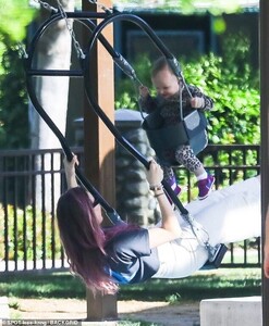 12603846-6949779-Whoosh_Once_at_the_park_Behati_wasn_t_afraid_to_let_her_hair_dow-a-1_1556012106414.jpg