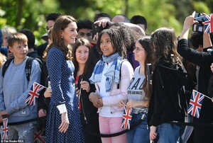 13486210-7027729-Schoolchildren_were_among_those_who_were_on_hand_to_welcome_Kate-a-34_1557855501131.jpg