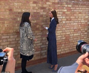 13486942-7027729-The_Duchess_of_Cambridge_was_surprised_with_two_bricks_dedicated-m-93_1557847624003.jpg