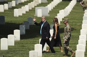 13877484-7064221-The_first_couple_spent_less_than_a_quarter_hour_at_the_cemetery_-a-34_1558644989280.jpg