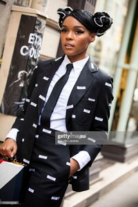 janelle-monae-wearing-a-black-printed-suit-black-tie-and-white-shirt-picture-id1133454230.jpg