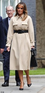 14350304-7102755-Simple_yet_sophisticated_Mrs_Trump_accessorised_the_coat_with_bl-a-12_1559665764573.jpg