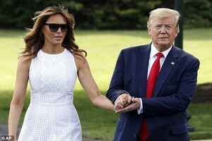14956820-7156509-Hot_out_here_Melania_wore_a_summery_white_eyelet_dress_for_the_o-a-39_1560907594262.jpg
