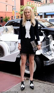 15065750-7165655-Looker_The_pretty_blonde_added_a_black_tasseled_mini_skirt_and_t-a-10_1561137505628.jpg
