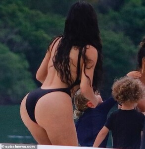 15128338-7170767-Not_shy_The_suit_featured_a_very_high_cut_bottom_that_further_ac-a-118_1561241000504.jpg