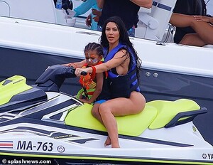 15128368-7170767-Careful_Kim_even_allowed_three_year_old_Saint_to_enjoy_a_spin_on-a-128_1561241000790.jpg