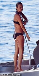 17192366-7349587-Practical_She_carried_a_towel_in_her_hand_ahead_of_jumping_into_-m-188_1565626259458.jpg