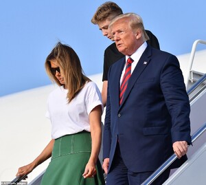 17426214-7369959-The_Trumps_stepped_off_Air_Force_One_after_arriving_at_Joint_Bas-a-11_1566203132877.jpg