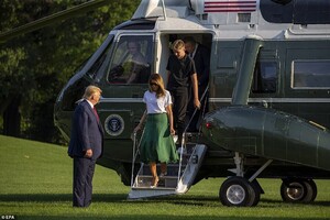 17426840-7369959-The_president_waited_for_his_wife_and_their_son_to_step_off_Mari-a-10_1566203132876.jpg