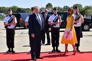 17641898-7389913-US_President_Donald_Trump_and_First_Lady_Melania_Trump_walk_past-a-62_1566649973184.jpg