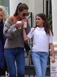 17763664-7400967-Sipping_tea_She_wore_her_brown_tresses_up_in_a_straight_back_pon-a-9_1566959122232.jpg