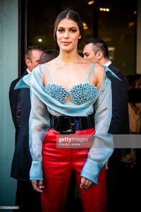 iris-mittenaere-wearing-a-light-blue-decorated-top-red-leather-pants-picture-id1162694963.jpg