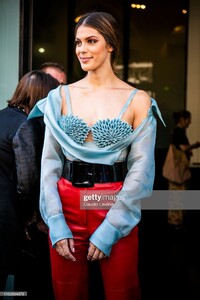 iris-mittenaere-wearing-a-light-blue-decorated-top-red-leather-pants-picture-id1162694978.jpg
