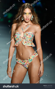 stock-photo-miami-beach-florida-usa-july-a-model-walks-the-runway-for-designer-luli-fama-during-1465977878.jpg