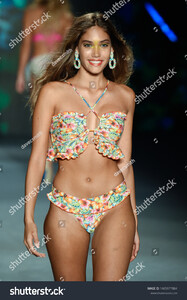 stock-photo-miami-beach-florida-usa-july-a-model-walks-the-runway-for-designer-luli-fama-during-1465977884.jpg