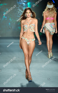 stock-photo-miami-beach-florida-usa-july-a-model-walks-the-runway-for-designer-luli-fama-during-1465977893.jpg