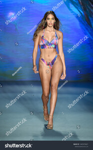 stock-photo-miami-beach-florida-usa-july-a-model-walks-the-runway-for-designer-luli-fama-during-1465978421.jpg
