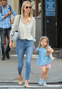 18589750-7474387-Casual_The_35_year_old_heiress_rocked_a_white_shirt_patterned_wi-a-96_1568746606579.jpg