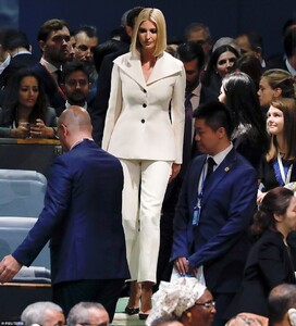 18878014-7499559-Make_way_Ivanka_certainly_stood_out_from_the_crowd_as_she_made_h-a-19_1569341315429.jpg