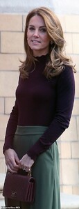 19486424-7553831-The_royal_wore_a_high_neck_long_sleeved_top_which_featured_scall-a-7_1570650015488.jpg