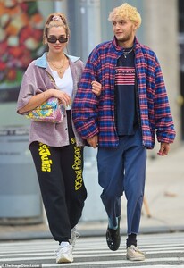 19594516-7563367-New_couple_The_happy_pair_looked_relaxed_as_they_strolled_around-m-26_1570809197190.jpg