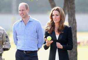 19880612-7587243-Playtime_Kate_holds_a_tennis_ball_in_the_grounds_of_the_training-a-2_1571428066474.jpg