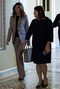 20089524-7605613-On_the_go_Melania_was_seen_leaving_the_roundtable_discussion_car-a-13_1571855329675.jpg