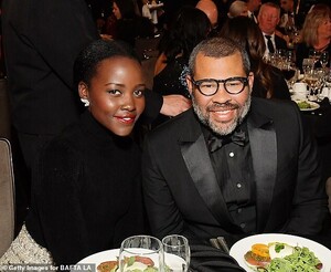 20206056-7615871-Oscar_winners_Lupita_Nyong_o_and_Jordan_Peele_snuggled_up_for_a_-a-52_1572063680112.jpg