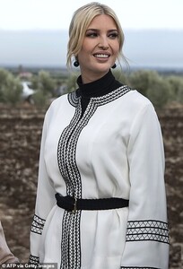 20717264-7660521-Chic_The_mother_of_three_wore_a_black_and_white_ensemble_for_the-m-111_1573137386803.jpg