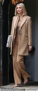 21253590-7707193-Style_Ivanka_donned_a_tan_suit_with_pleated_dress_pants_and_a_ma-a-1_1574273147971.jpg