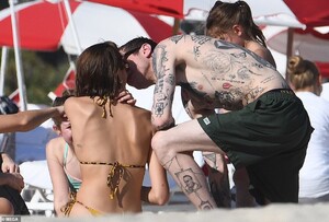 21363326-7716869-Catching_some_rays_In_addition_to_sampling_the_surf_Kaia_strippe-a-54_1574479912189.jpg