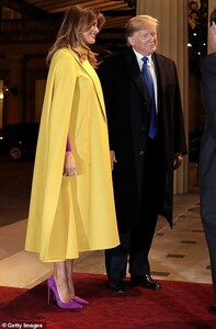 21772762-7752119-All_smiles_The_First_Lady_beams_as_she_is_greeted_at_Buckingham_-m-69_1575398340750.jpg