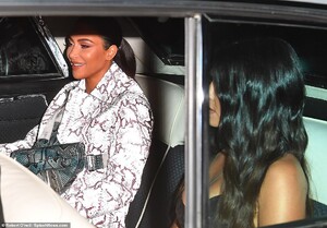 21787210-7753583-Riding_in_style_The_sisters_were_spotted_earlier_as_they_hopped_-a-190_1575435142390.jpg