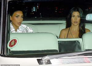 21787214-7753583-Backseat_drivers_The_sisters_sat_backseat_as_they_arrived_at_the-a-187_1575435142258.jpg