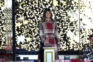 21884890-7761719-First_lady_Melania_Trump_was_tapped_to_do_the_honors_and_pushed_-a-14_1575588383658.jpg