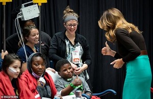 21923432-7765237-All_good_One_young_boy_flashed_a_thumbs_up_at_the_first_lady_as_-a-134_1575674919683.jpg