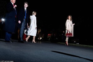22517168-7815917-The_first_lady_far_right_flashes_a_smile_as_she_and_her_family_w-a-32_1576890762759.jpg