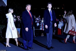 22517620-7815917-Trump_s_youngest_son_Barron_towered_over_his_father_while_wearin-a-25_1576890762609.jpg