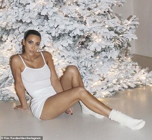 22636696-7825399-Holy_in_white_Kim_wore_the_bone_colored_tank_top_retailing_for_3-a-14_1577218860956.jpg