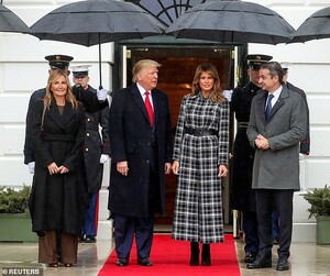 23123818-7862335-Keeping_try_Black_umbrellas_were_held_over_the_two_couples_as_th-a-28_1578454905201.jpg