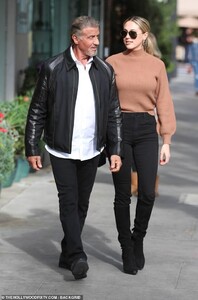23218702-7871379-Nattily_dressed_Stallone_wore_a_crisp_white_shirt_left_untucked_-m-23_1578618973881.jpg
