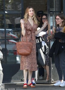 23446312-7891933-Outfit_1_Her_first_looks_featured_an_orange_polka_dot_patterned_-m-104_1579131016462.jpg